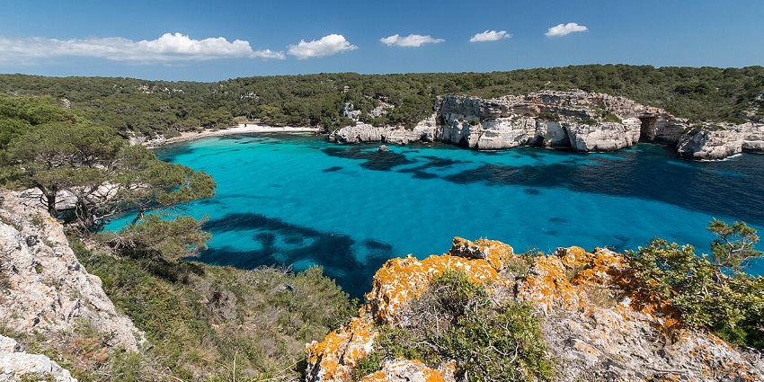 Admiring turquoise bays is one of the most breathtaking things to do in Menorca Spain.
