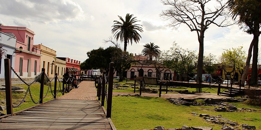 Visiting the Plaza de Armas Manuel Lobo in Uruguay with a wooden walking deck, one of the best things to do in Colonia Uruguay.
