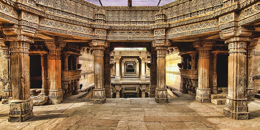 Intricate stone carvings on the walls of the centuries-old Adalaj Stepwell in Gujarat.