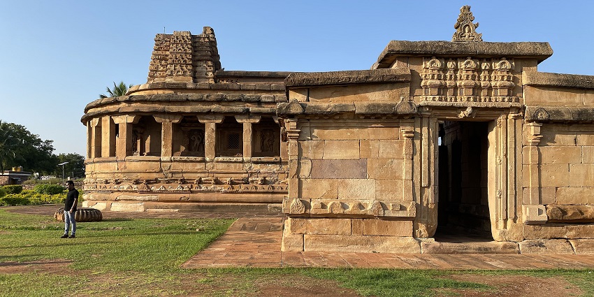 Aihole with ancient monuments with intricate carvings and historic architectural structures.