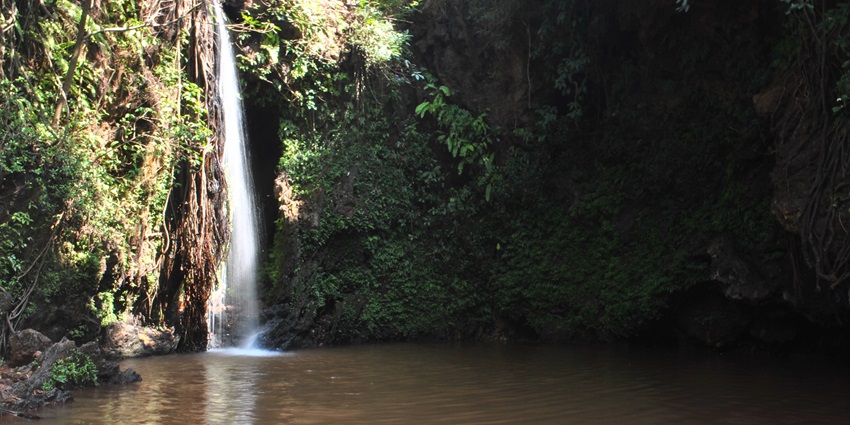 Waterfall at Apsarkonda flowing into rocky pond is among scenic places to visit near Byndoor.