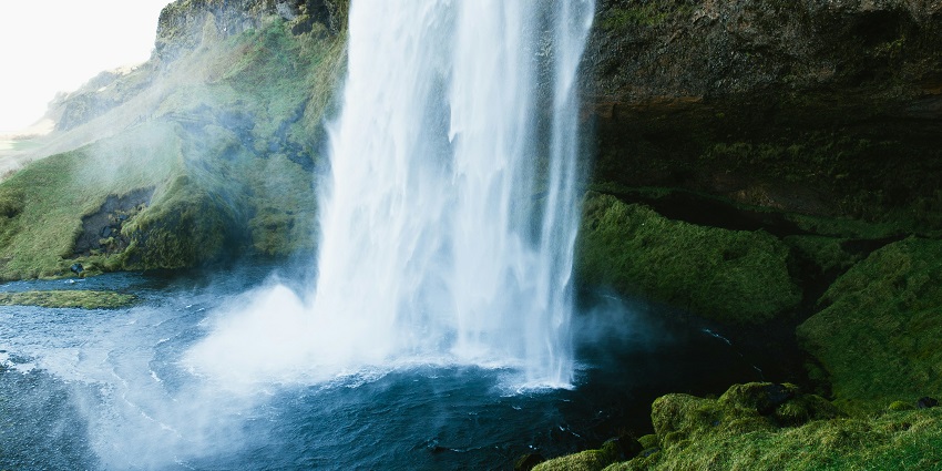 Breathtaking Barkana Falls cascading from a height amidst lush green forest in Karnataka.