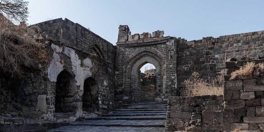 Historic Belapur Fort with stone-paved stairs, one of the iconic places to visit near Ghansoli.
