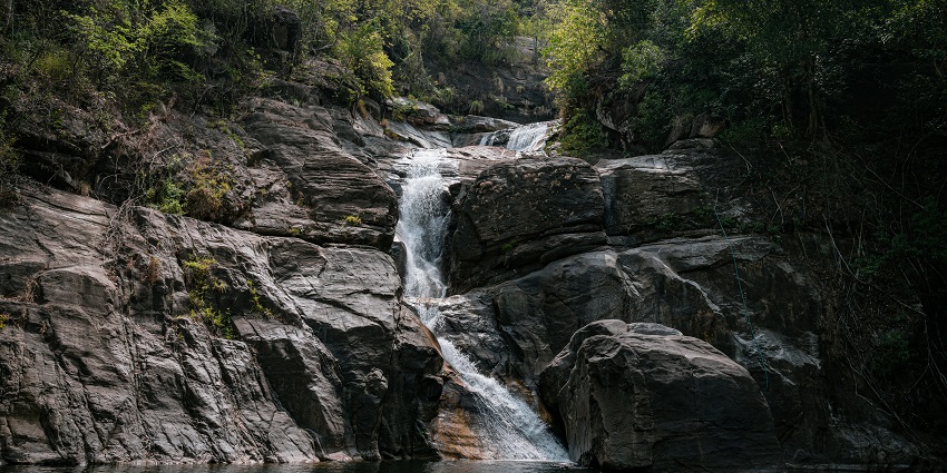 Majestic Randha Falls cascading amidst lush greenery in Bhandardara.