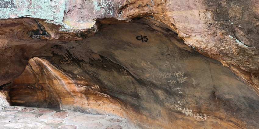 Bhimbetka rock shelters in Madhya Pradesh with unique rock formations and inscriptions on the rocks.