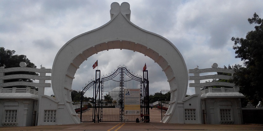 At the uniquely shaped entrance of the Buddha Vihar, one of the best places to visit near Gulbarga.