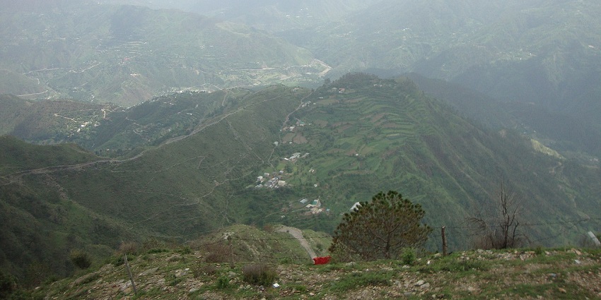 Broad green valley, distant hills and terraced farms, still relaxed business of the town of Chail