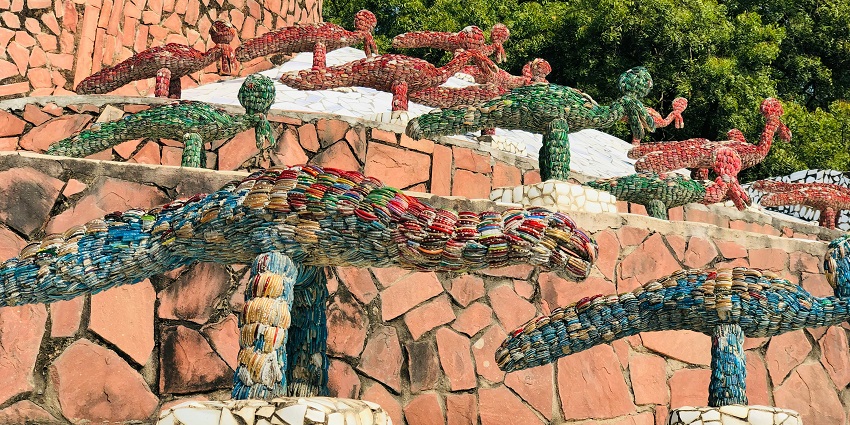 Intricate sculptures and pathways are made from recycled materials in a unique rock garden.