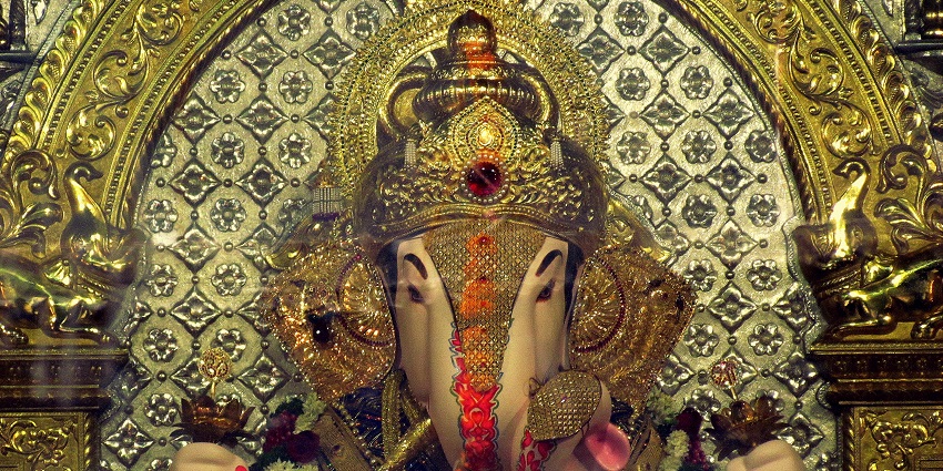 Views of a Ganesh idol exquisitely draped in gold at the Dagdusheth Halwai Ganpati Temple.