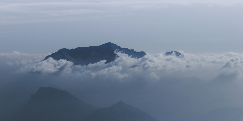 Cloud-covered mountain peak is one of the misty places to visit near Dalhousie in December.