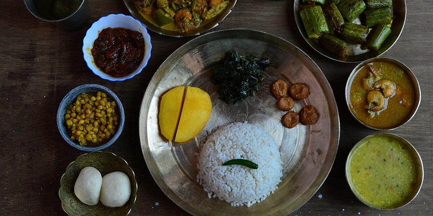 A delicious spread of traditional Odia food featuring rice, curries, and local delicacies.