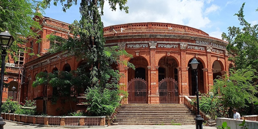 The Government Museum, red building, and trees, one of the places to visit near Greams Road Chennai.
