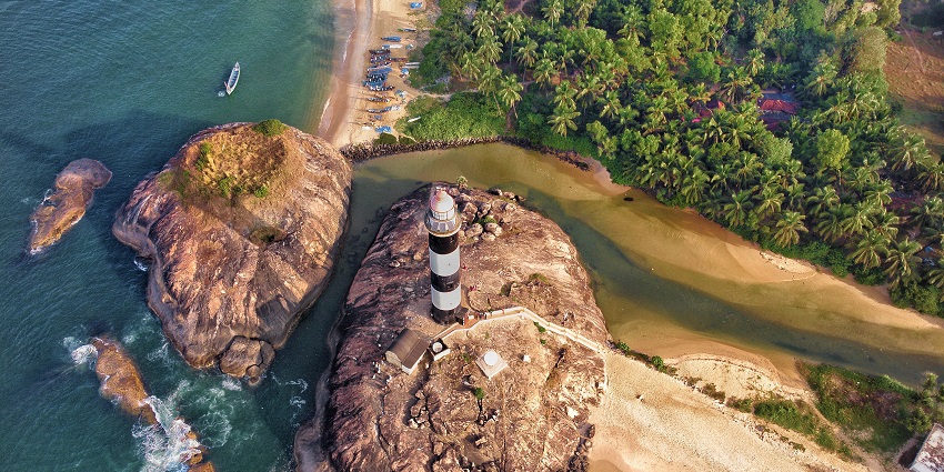 Aerial view of Kapu Beach and its iconic lighthouse, a scenic gem among places to visit near Hebri.
