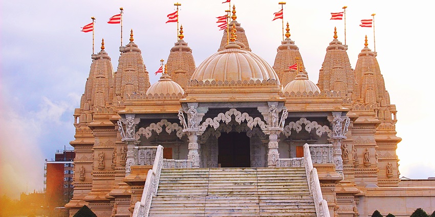 Kasar Devi Temple with stone architecture and a clear sky in the background.