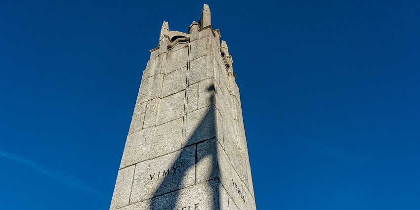 Khongjom War Memorial Complex with memorial pillars and scenic hill views under a clear sky.
