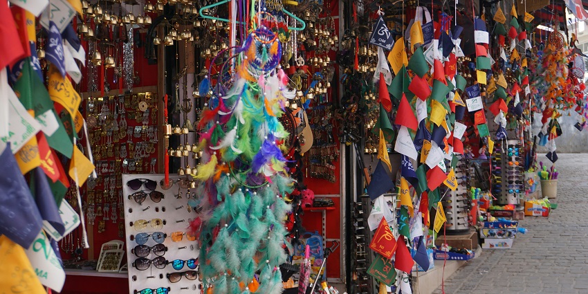 Library Bazaar in Mussoorie with multiple shops and old-style building structures.
