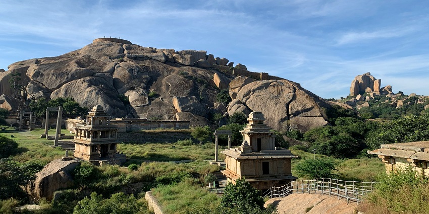 Madhugiri fort in Karnataka with a traditional architectural building of the fort on top of the mountain.