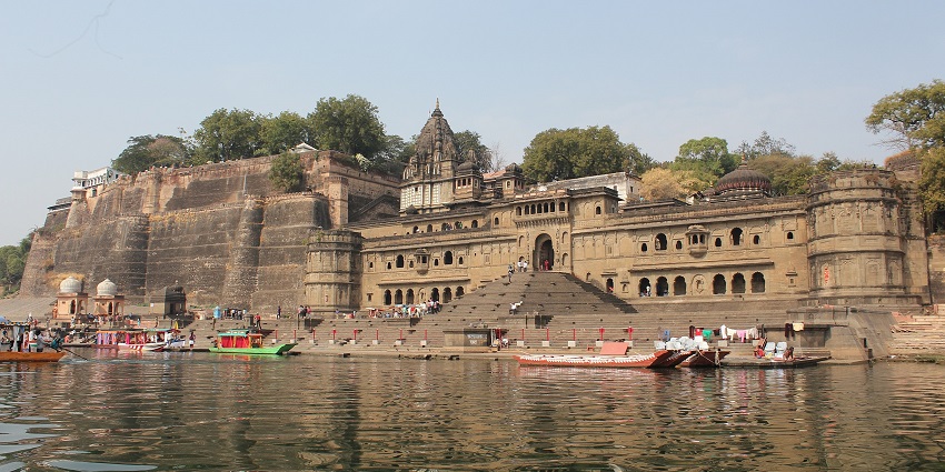 Ancient riverside fort with stone ghats, royal waterside architecture.