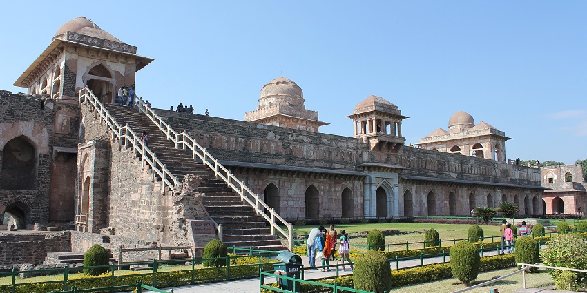 Massive stone building with domes and staircases, a remarkable landmark among places to visit near Indore for 2 days.