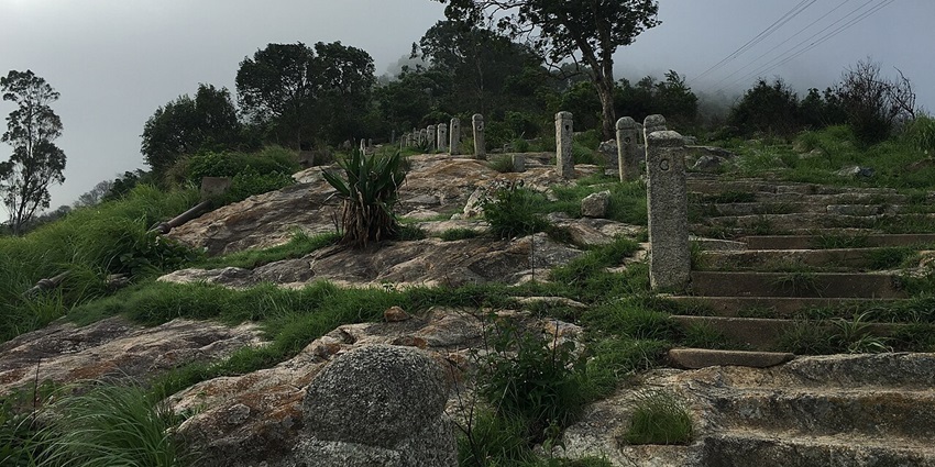 Stone steps and pillars at Nandi Hills trek are among scenic places to visit near Dabaspet.