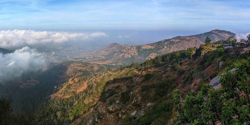 Lush green valleys and misty view at Nandi Hills, one of the top places to visit near Bangalore for 1 day.