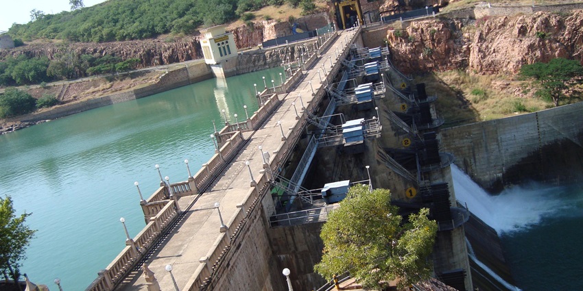 Water flowing through gates at Navila Teertha Dam is among places to visit near Chikodi.