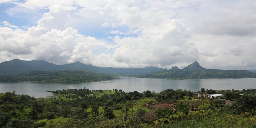Scenic Palghar lake surrounded by hills and greenery, a peaceful spot among the best places to visit near Mumbai for 2 days.