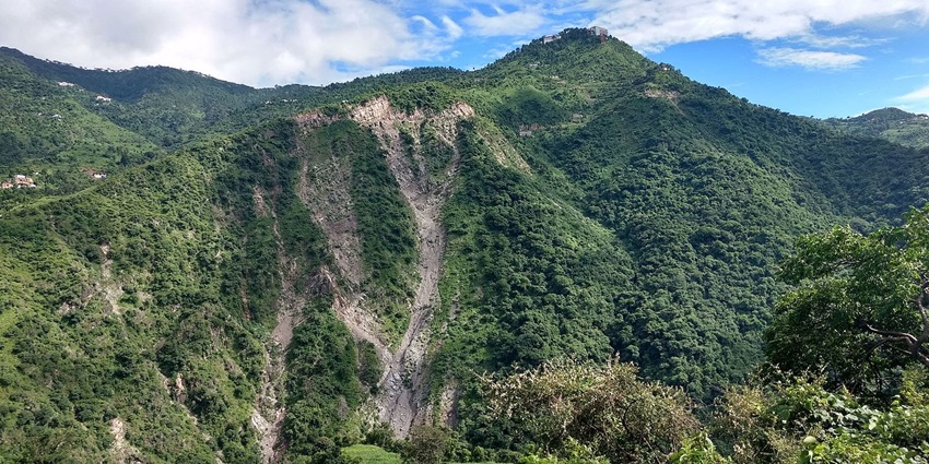 Green Parwanoo hills with landslide marks and forests are among the places to visit near Chandigarh in winters.