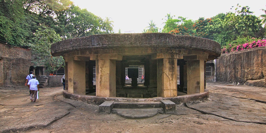 Views of a circular stone layout at the Pataleshwar Cave Temple and surrounding courtyard, one of the best places to visit near FC Road.