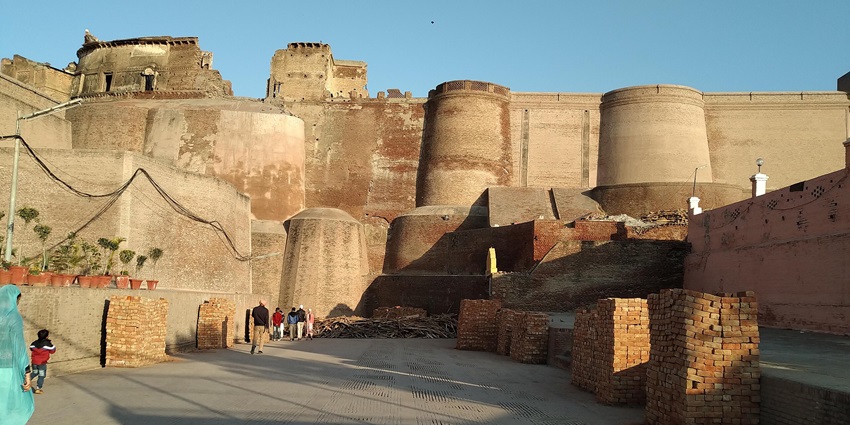 Historic Qila Mubarak with red sandstone walls and traditional Mughal-style architecture.