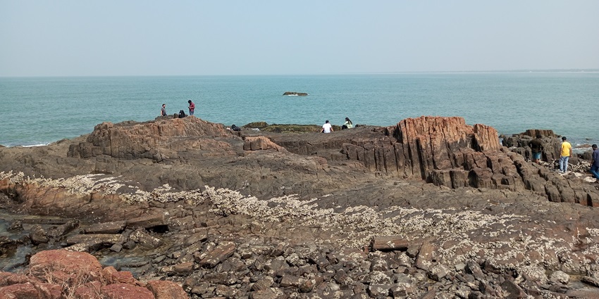 St. Mary’s Island aerial shot showing the surrounding sea waters and many visitors.
