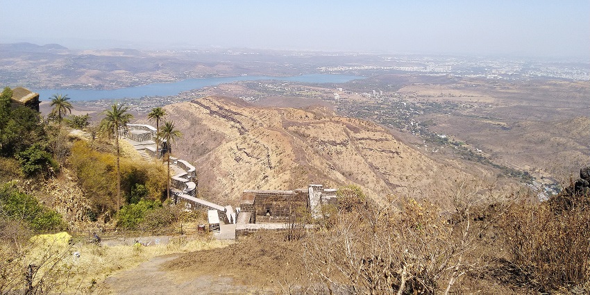 A wide view of the Sinhagad Fort from the top of a nearby hill , one of the best picnic places to visit near Pune.