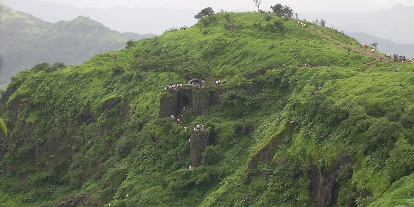 Views of Sinhagad Fort from the top of the small green hills in the mountains, one of the best places to visit near FC Road.