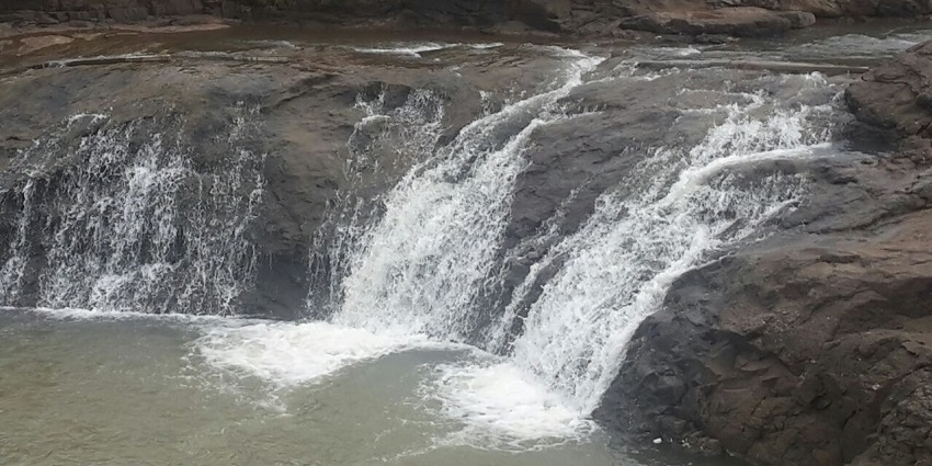 Beautiful view of Someshwar waterfall with water cascading down quickly with rocky surroundings