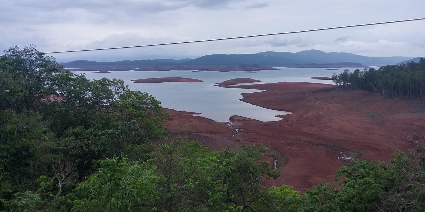 Views of lush scenery as the Kali River flows through the gates of Supa Dam, one of the best places to visit near Dandeli.