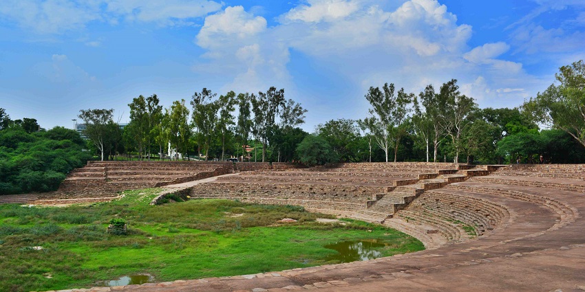 Surajkund masonry in Faridabad, featuring its semi-circular stepped stone embankment.