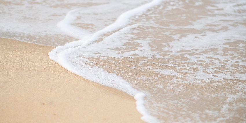 Suvali Beach with clean sandy shore and gentle waves, a serene place to visit near Surat for 1 day.