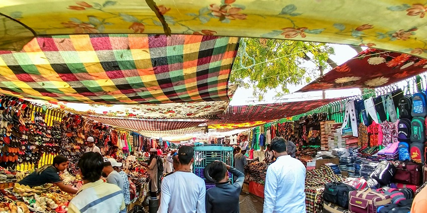Varanasi market stalls are lined up with vibrant colors and traditional items, showcasing local culture and crafts.