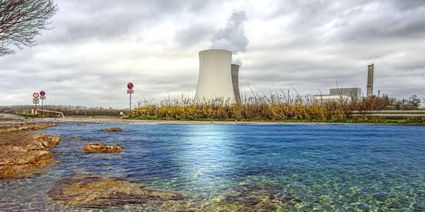 Viewpoint overlooking the tranquil Thermal Plant Lake with still waters and a distant skyline.