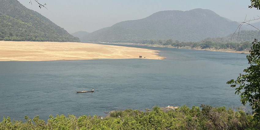 Mahanadi from Tikarpada with a large water body of the river and a distant boat, one of the places to visit near Bhubaneswar within 200 km.