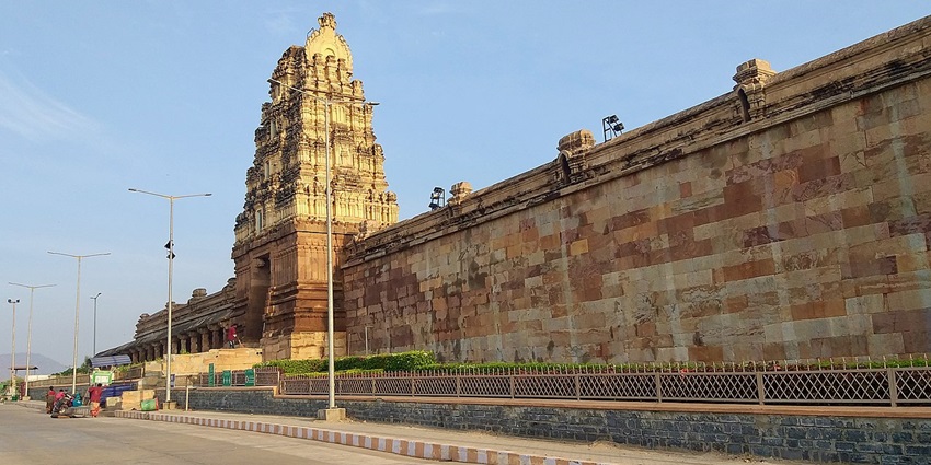 The tall golden gopuram of Kodandarama temple in Vontimitta, Andhra Pradesh, at sunset.
