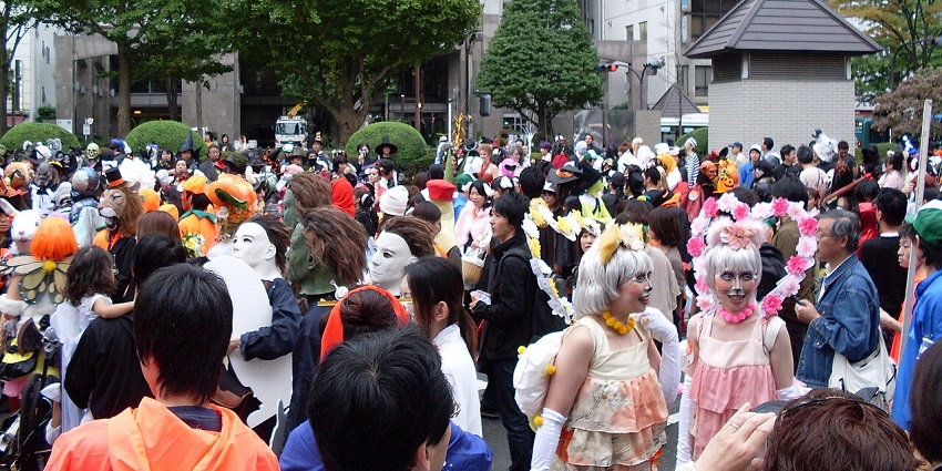 A group of people wearing costumes dances during the Halloween celebrations in Japan, similar to what's expected in Halloween day 2025.