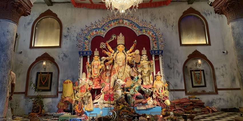 Intricate Durga idol display at Ahiritola Sarbojanin pandal, adorned with festive decorations during Durga Puja in Kolkata.