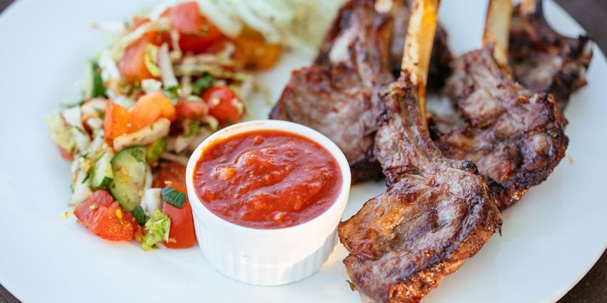 Plate of lamb with dip served at Amrina, one of the top restaurants in Woodlands.