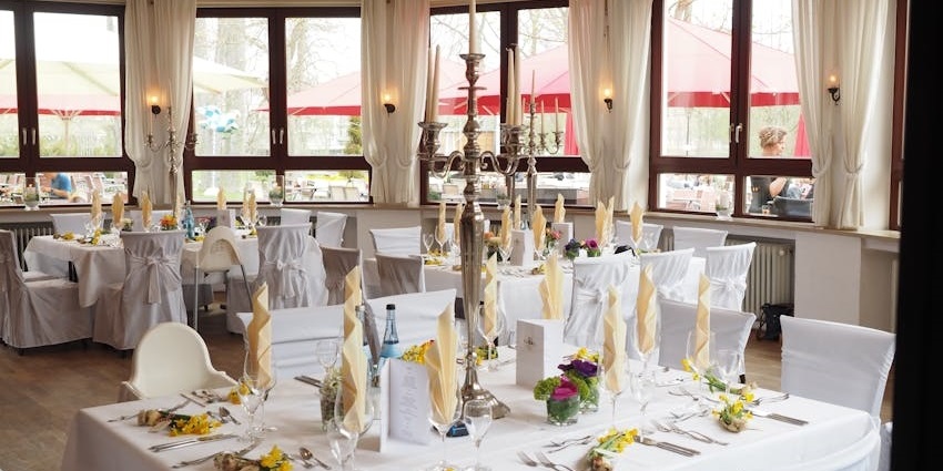 The Annalakshmi interior with white tablecloths and candlesticks, one of the veg restaurants in Malaysia.