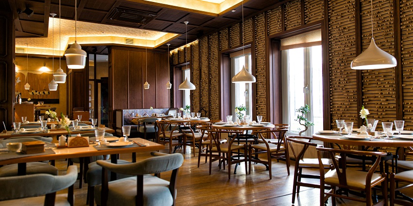 Annapurna Pure Veg Hotel interior with table, chairs and hanging lights, one of the popular restaurants in Namchi.