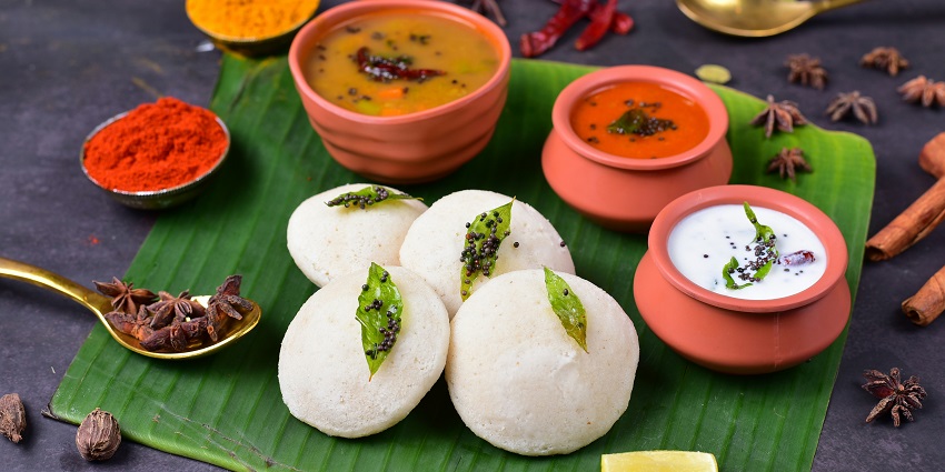 South Indian vegetarian platter served on a traditional plate at a casual dining restaurant.