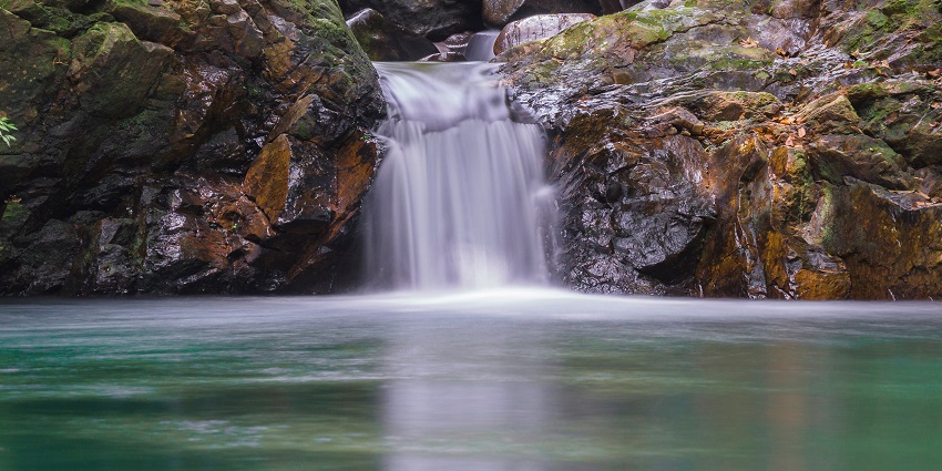 Waterfalls through dense jungle in Bạch Mã, one of the national parks in Vietnam.
