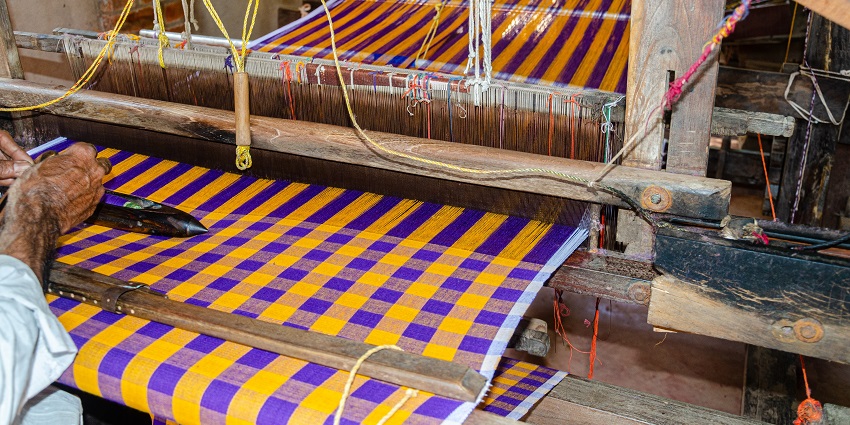 Traditional handloom weaving equipment displayed in Badami and Ilkal, Karnataka.

