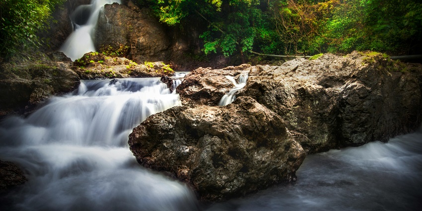 Bamanbudo Waterfall is surrounded by lush greenery, showcasing one of the beautiful waterfalls in Goa.

